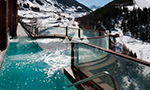 Relaxing outdoor jacuzzi with ski slopes views